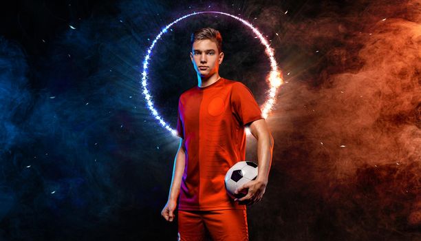 Soccer player. Athlete in football sportswear on game with ball. Sport concept