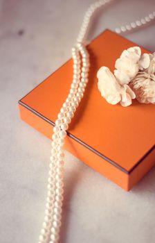 Present box and flowers for her - Mother's day ideas, happy giving and holiday inspiration concept. The perfect gift for mom