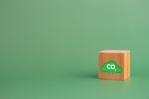 Net zero and carbon credit with wood cube block icon co2 eco on green background.