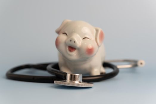 medical stethoscope piggy bank business concept insurance investment health care and saving money.