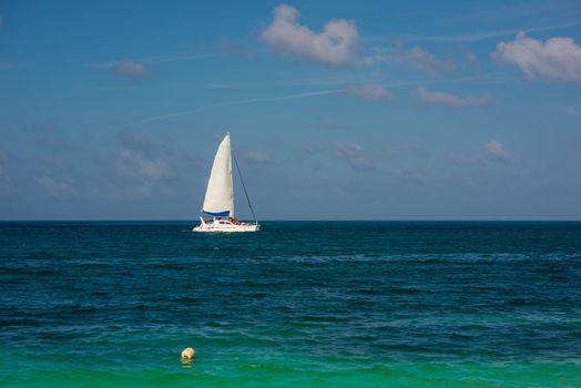 Sailboat in the sea luxury summer adventure, active vacation in Mediterranean sea. Blue water color