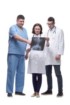 in full growth. medical colleagues discussing the x-ray. isolated on a white background.