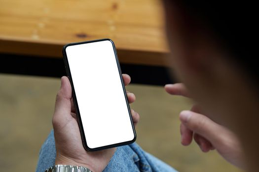 Asian Man hand holding smartphone empty screen. Technologt concept.