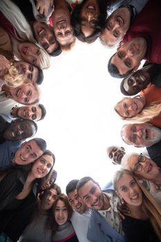 close up. large group of various happy people standing in a circle.