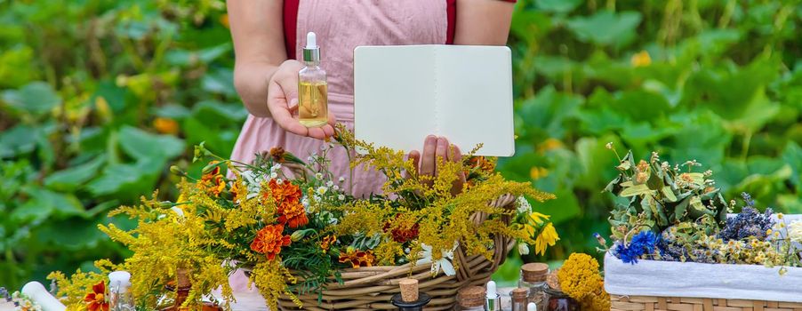 Medicinal herbs on the table. Place for notepad text. woman. Selective focus. nature.