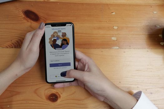 CHIANG MAI, THAILAND - AUG 26, 2022 : Microsoft Teams business application on smartphone screen.