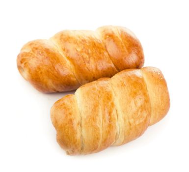 Fresh appetizing bun with sausage on a white background