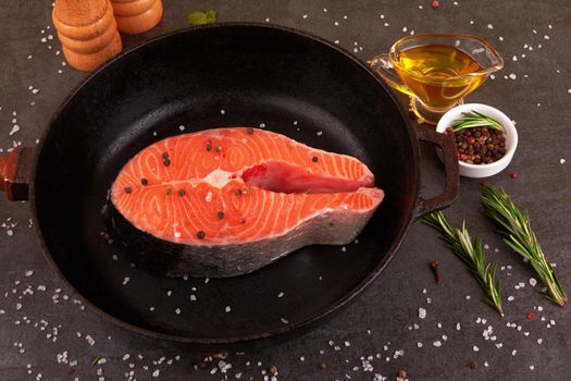 Salmon steak on a pan with spices