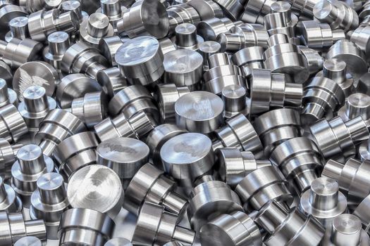 Pile of many engineering parts after turning and machining.