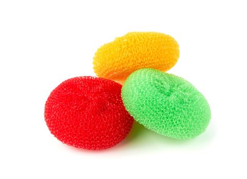 Colorful sponges for washing dishes on a white background