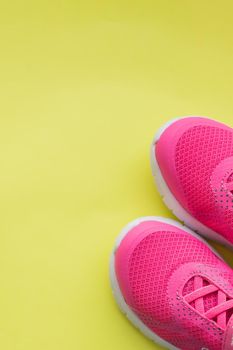 Blue children's sports shoes on a turquoise, mint background. The concept of using sport shoes by children