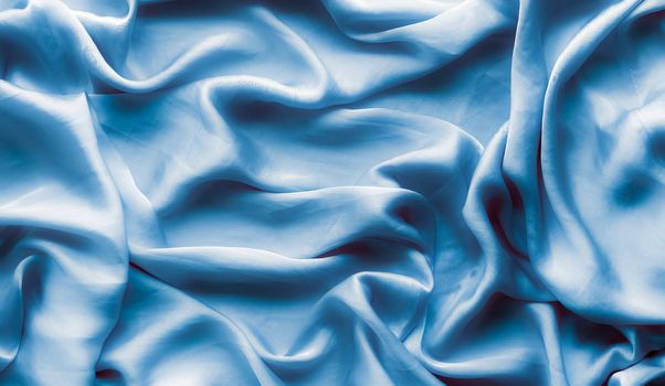 Blue soft silk waves, flatlay - elegant fabric textures, abstract backgrounds and modern pastel colours concept. Feel the touch of luxury