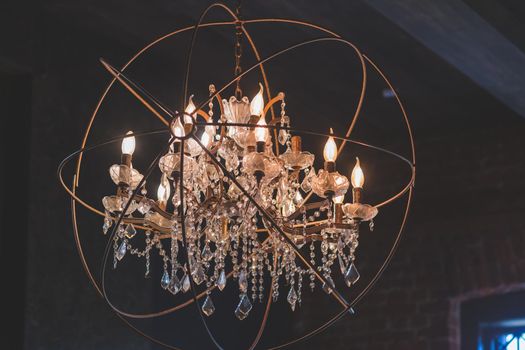 Chrystal chandelier close-up. Glamour background with copy space