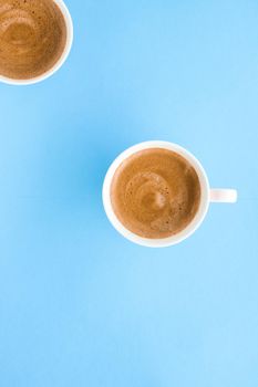 Breakfast, drinks and modern lifestyle concept - Hot aromatic coffee on blue background, flatlay