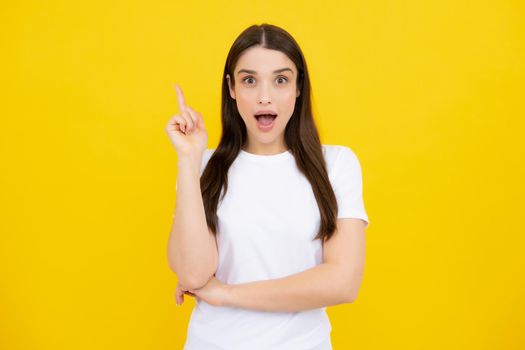 Woman point at copy space, showing copyspace pointing. Promo, girl showing advertisement content gesture, pointing with hand recommend product. Isolated background