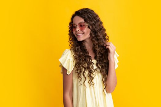 Happy teenager, positive and smiling emotions of teen girl. Headshot portrait of teenager child girl isolated on studio background. Childhood lifestyle concept. Mock up copy space