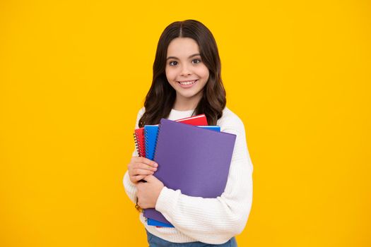 Teenage school girl with books. Schoolgirl student. Happy face, positive and smiling emotions of teenager girl