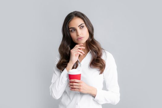 Business woman coffee hild cup coffee over gray background