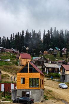 Famous georgian mountain resort Bakhmaro in summer view with old buildings