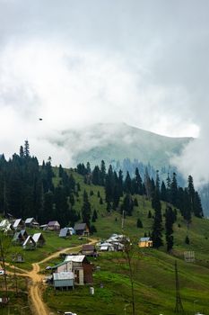 Famous georgian mountain resort Bakhmaro in summer view with old buildings