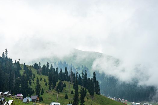 Famous georgian mountain resort Bakhmaro in summer view with old buildings