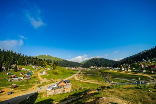 Famous georgian mountain resort Bakhmaro in summer view with old buildings