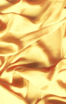 Luxury golden silk background texture - elegant fabric textures, abstract backgrounds and modern pastel colours concept