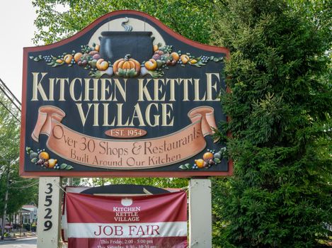 A Street Sign Telling About Kitchen Kettle Village on a Sunny Day