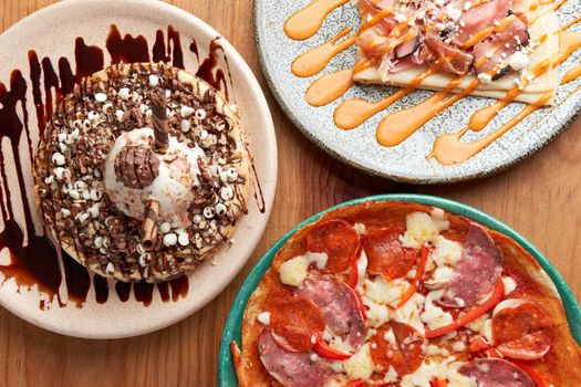 picture of delicious crepe, chocolate ice cream waffle and pizza.
