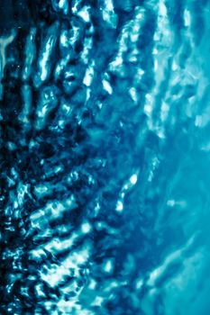 Abstract blue liquid surface as background - futuristic design and science concept. Deep blue waters