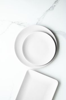 White empty plate on marble, flatlay - stylish tableware, romantic table decor and food menu concept. Serve the perfect dish