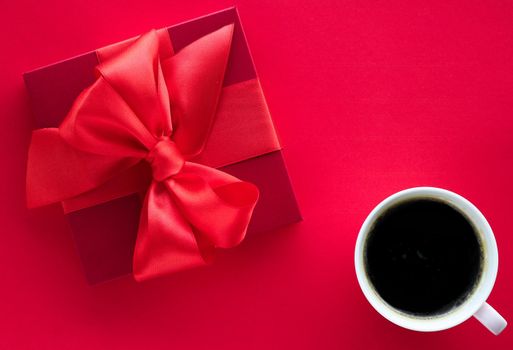 Romantic celebration, lifestyle and birthday present concept - Luxury beauty gift box and coffee on red, flatlay