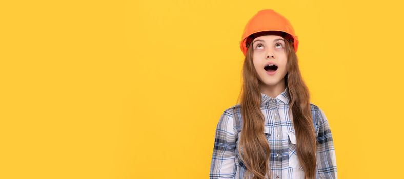 look here. childhood development. happy labour day. future career. teen girl in helmet. Child in hard hat horizontal poster design. Banner header, copy space