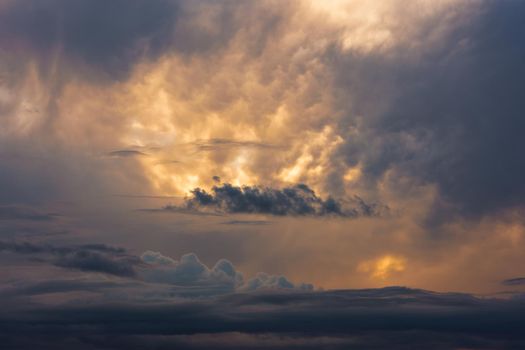 dramatic evening clouds at summer sunset without horizon, shot on 91mm at full-frame 35mm digital camera