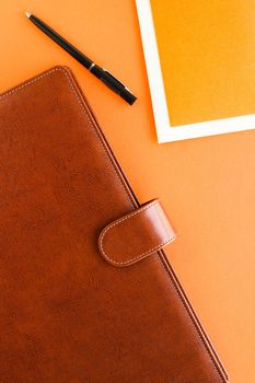 Modern workspace, productivity and corporate lifestyle concept - Luxury business brown brief-case on the office table desk, flatlay