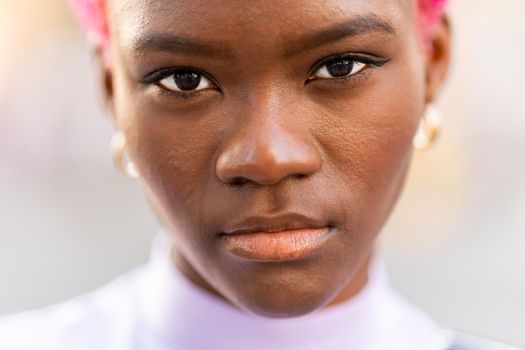 Close up portrait with selective focus on the beauty eyes of a young african woman