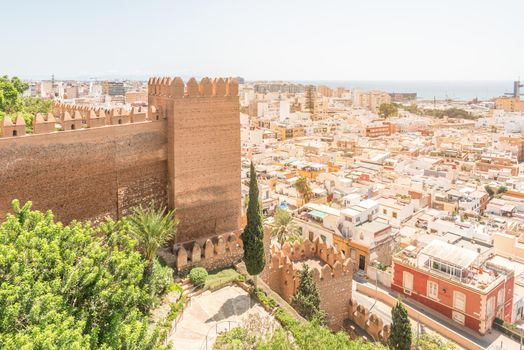 Picturesque view of aged stone citadel with tower located in Almeria city Andalusia Spain near sea in sunny day