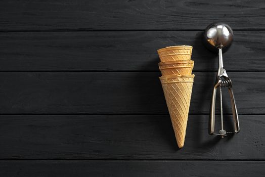 top view, wafer cups for ice-cream on dark wooden table.