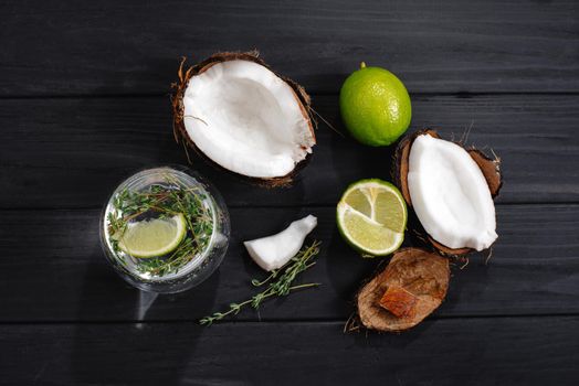 hard seltzer with different ingredients on a black wooden background top view.