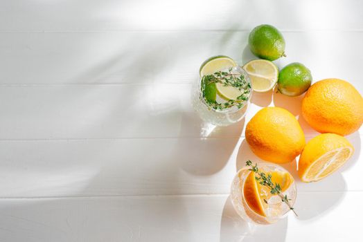 Strong seltzer cocktails with lime and Hard seltzer cocktails Alcoholic beverage with tonic and orange on a light background. Top view. Copy space