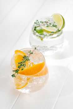 two glasses with an alcoholic cocktail on a light background. hard seltzer is a low-alcoholic drink. Vertical shoot