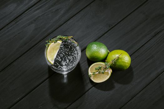 Hard seltzer with lime on a dark wooden background. Top view