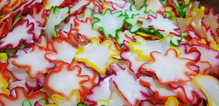 Onion rice flour crackers or Indonesian called it Kerupuk bawang mentah or kerupuk warna-warni or raw kerupuk bawang is rice crackers, Indonesian traditional dish. Selective focus.