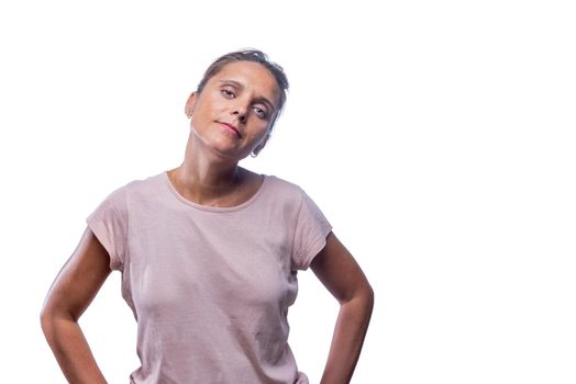 Front view of a self-confident woman looking at camera on a white background with copy space.