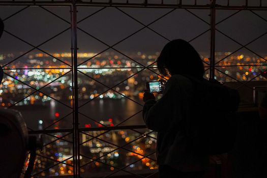 Person who shoots a night view of New York. Shooting Location: New York, Manhattan