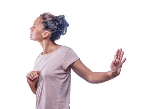 Annoyed woman asks not to be spoken to on a white background.