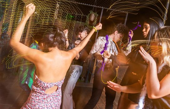 People dancing and having fun on a terrace at New Year's Eve