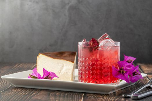 Strawberry tea and san sebastian cheesecake on wooden table