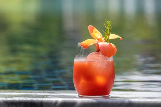 Refreshing citrus and alcoholic cocktail on dark background