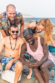 four multiracial friends having a good time at the beach, vertical close up view